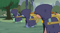 Cloaked ponies pulling carts of pies S7E23