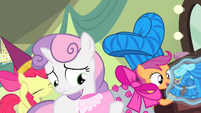 Apple Bloom and Scootaloo seem pleased with their costumes. Sweetie Belle doesn't seem so sure.