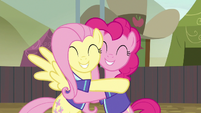 Fluttershy and Pinkie Pie hugging with joy S6E18