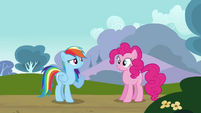 Rainbow flies in front of Pinkie.