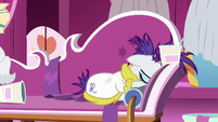 Rarity buries her face in the couch fabric S7E19