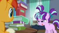 Filly Starlight trying to levitate a book out of the book tower S5E26
