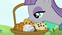 A basket of muffins? I notice there's a rock in it.