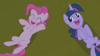 Twilight and Pinkie, laughing.