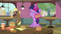 Twilight wiping her face with a hay burger S4E15