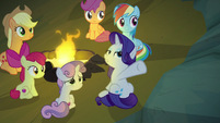 Rarity gesturing at the cave walls S7E16