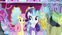 Rarity looking through a clothing rack S5E21