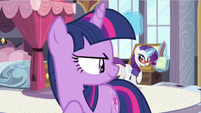 Rarity only takes quick notice of Twilight's words.