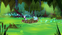Ranbow and Rarity speed across the swamp S8E17