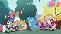 Ember shields her ears from trumpet fanfare S7E15