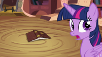 Twilight Sparkle about to pick up book S4E09