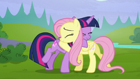 Twilight and Fluttershy hugging S5E23