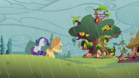 Applejack and Rarity look at the library S1E08