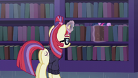 Moon Dancer places book back on the shelf S5E12