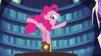 Pinkie Pie balanced on top of the book EG2