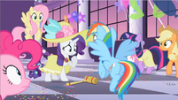 Rainbow listening to Rarity's explanation.