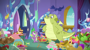 Spike and Sludge surrounded by pony stuff S8E24