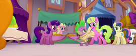 Spike running with armfuls of scrolls MLPTM