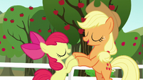 Apple Bloom and Applejack bump their hooves S5E17