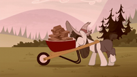 Piles McColt pushing a wheelbarrow of bricks S5E23