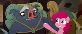 Pinkie offering breath mint to pig creature MLPTM