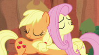 Applejack and Fluttershy hugging S8E23