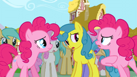 Pinkie Pie talking to another Pinkie Pie in front of the crowd S3E3