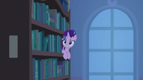 It's a horse in a bookcase!