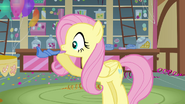 Fluttershy blowing a party horn S3E13