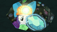 Rarity extracting a gem from a cave wall S9E19
