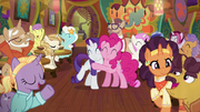 Pinkie and Rarity hug while surrounded by friends S6E12