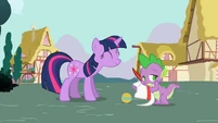Twilight is very pleased with Spike.