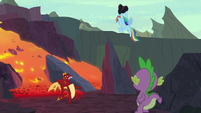 Rainbow Dash holds the rock over Garble S7E25