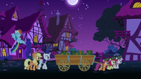 Crusaders hauling cart of boxes at nighttime S6E15