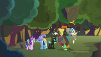 Discord looks for Fluttershy under a large rock S6E25