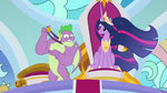 Spike holds up his royal advisor medal S9E26