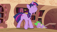 Twilight keeping a face for a long time must run in her family... ...and Spike is unamused.