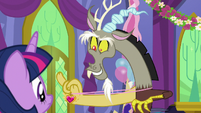 Discord showing his medal to Twilight S7E1