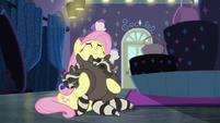 Fluttershy hugging the raccoons S8E4