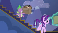 Spike carrying a heavy box of books S6E25