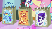 Rainbow, AJ, and Rarity's candy bags S5E21