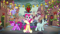 The Spirit of Hearth's Warming Presents standing in front of the town's water fountain S06E08