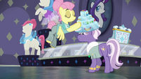 Fluttershy puts jewel display on customer's head S8E4