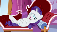 Rarity lying back on her couch S6E22