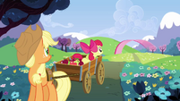 Applejack and Apple Bloom look at Pinkie zooming off S3E3