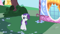 Rarity conceals the package in her tail.