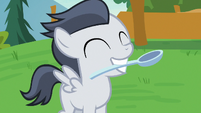 Rumble grins happily with spoon in his mouth S7E21