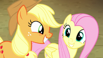 Applejack and Fluttershy smile at each other S8E18