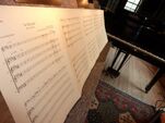 A music stand with the vocal sheet music on it