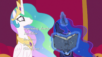 Princess Luna looks closely at Star Swirl's journal S7E25